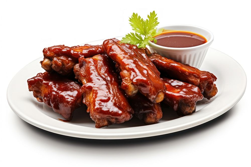 Plate of cut baby back ribs with barbecue sauce grilling ketchup plate.