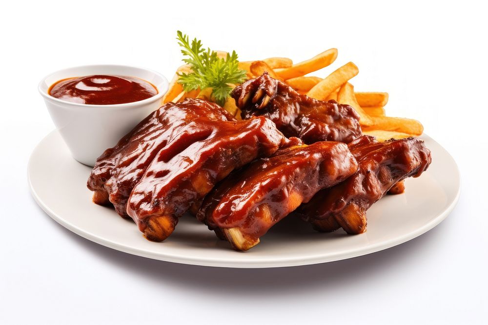 Plate of cut baby back ribs with barbecue sauce ketchup plate meat.