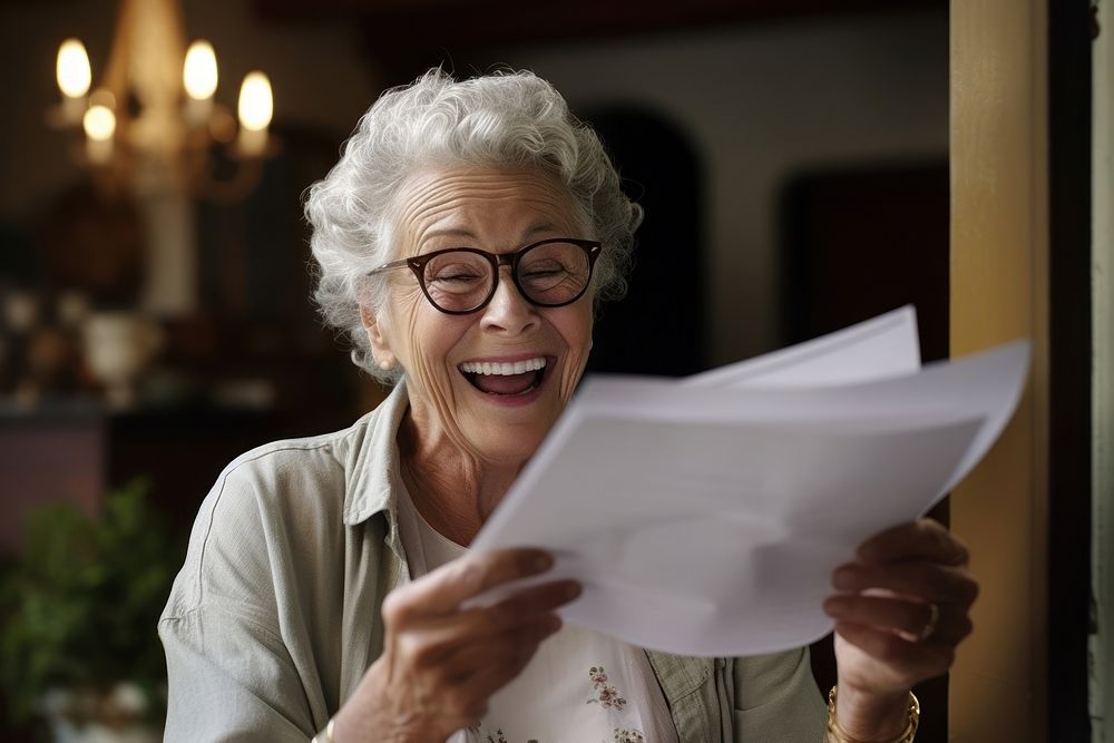 Senior woman reading a letter glasses looking adult.