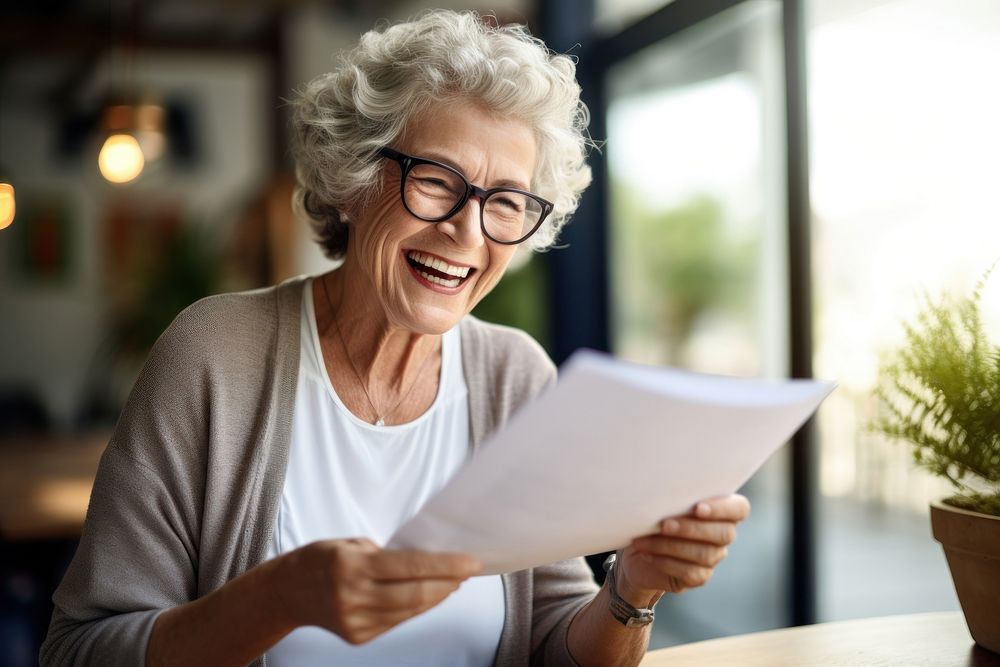 Senior woman reading a letter glasses looking adult.