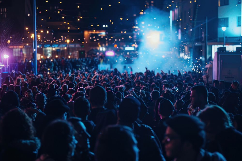 Photography of large audience nightlife celebration concert.