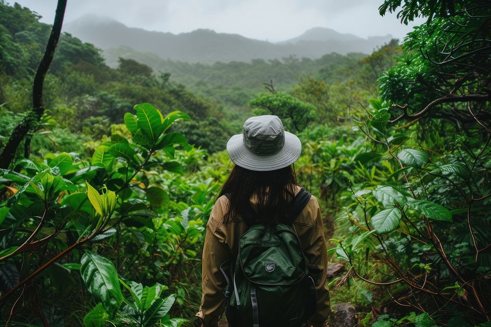 Woman in hiking clothe land outdoors backpack.