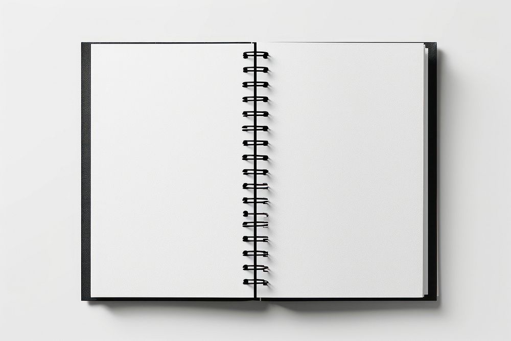 Open spiral bound notepad white paper diary black page.