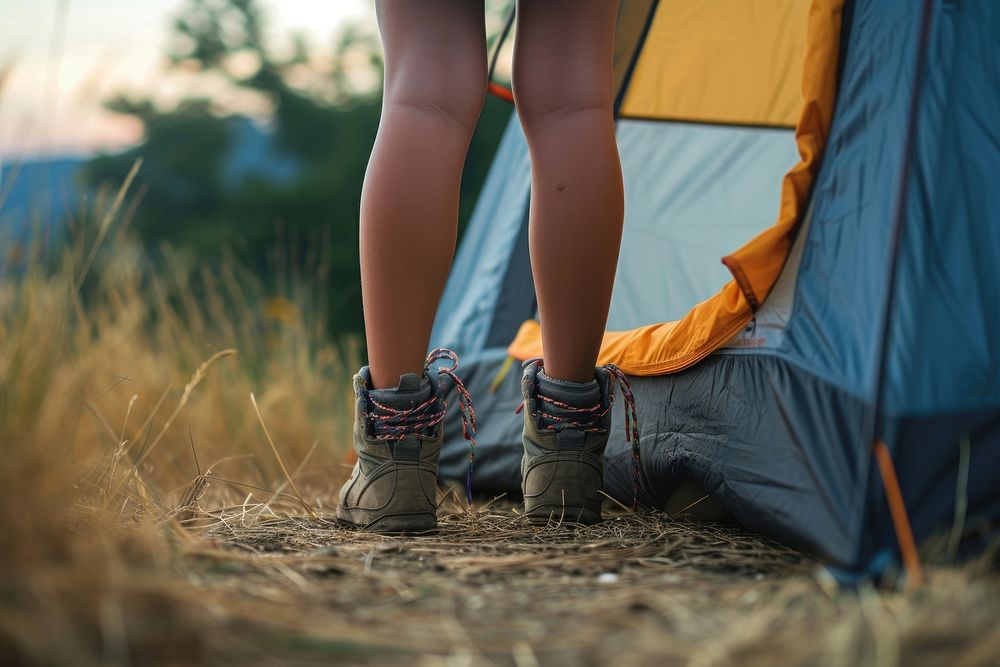 Close up leg woman standing against tent footwear outdoors camping.