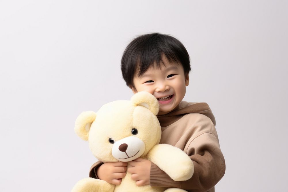 Little asian boy with teddy bear portrait child happy.