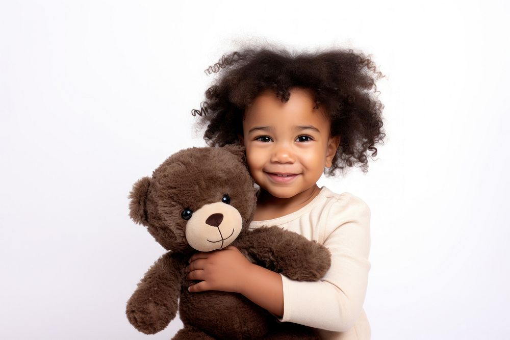 Little black girl with teddy bear portrait child smile.