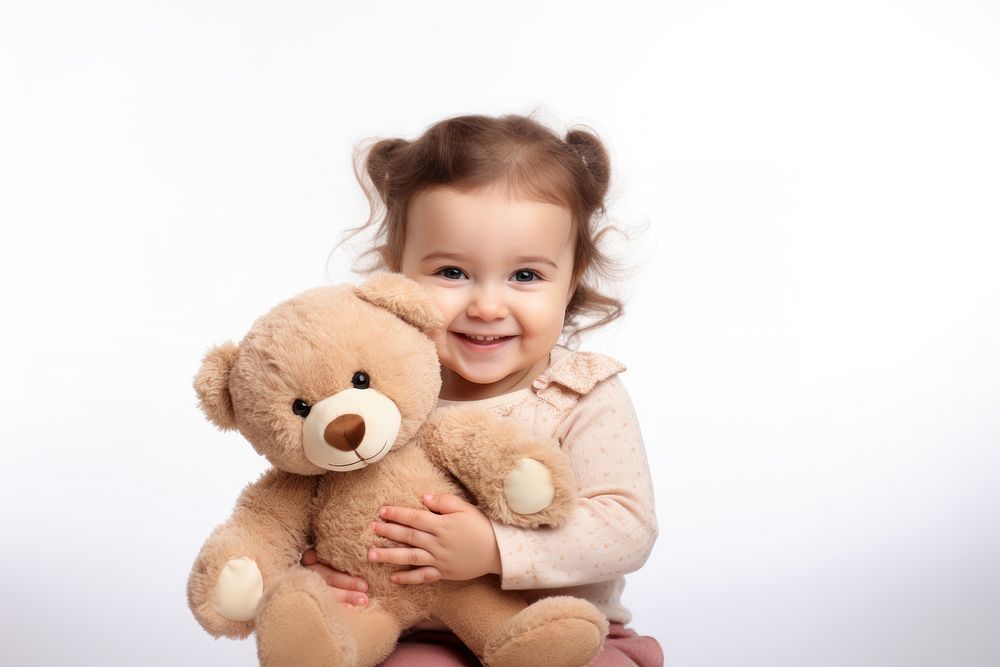 Little girl with teddy bear portrait smile photo.