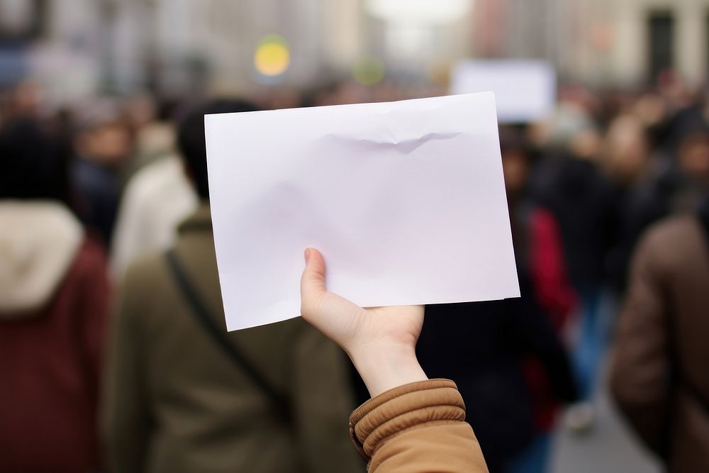 Hand holding flash mob paper sign advertisement architecture handwriting.