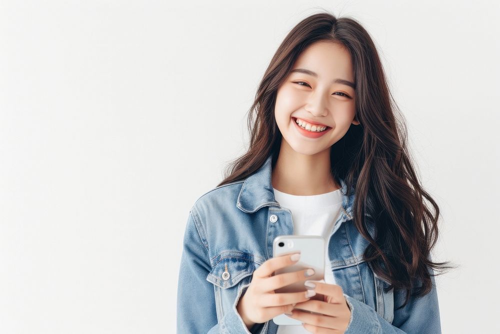 Happy young asian girl using phone smile photo white background.