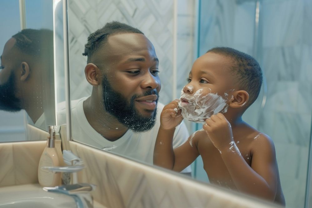 African American father and son bathroom bathing mirror.