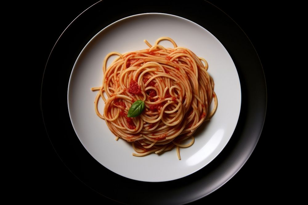 Spaghetti on a flok pasta plate food.