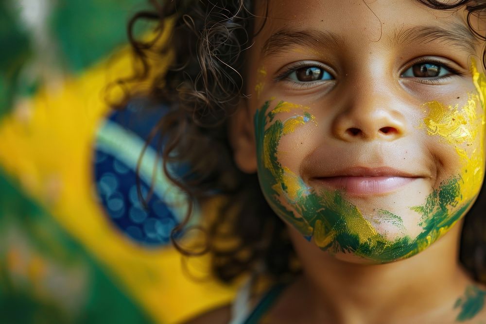A child with a painted flag Brazilian portrait smile skin.