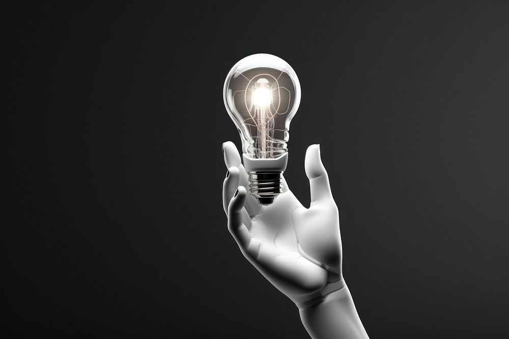 Hand holding light bulb lightbulb electricity innovation.