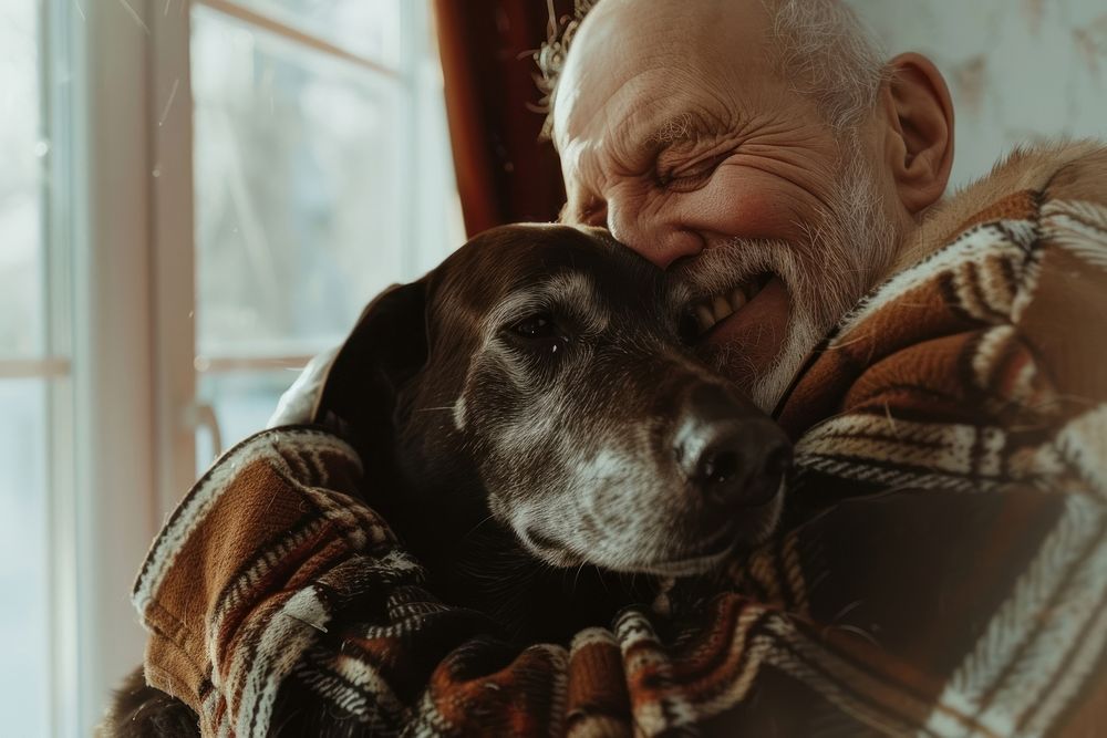 Happy elderly man hugging dog portrait mammal animal.