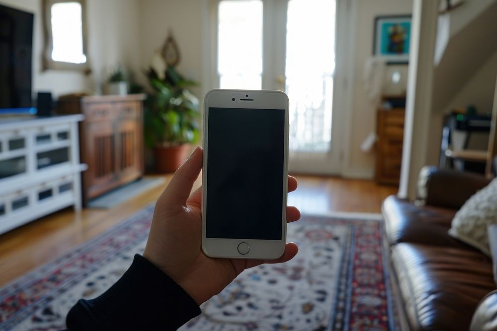 Student holding white screen of cellphone electronics photographing portability.