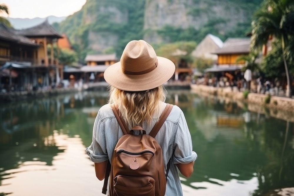 A Young tourist happily takes photos travel adult architecture.