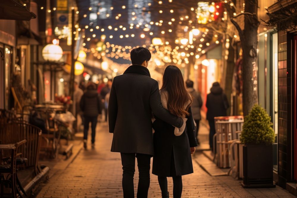 Korean couple walking street shopping.