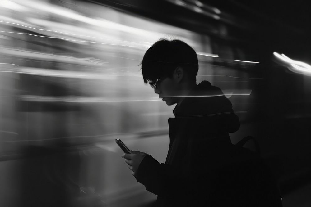 Photo of person person holding cellphone photography silhouette transportation.