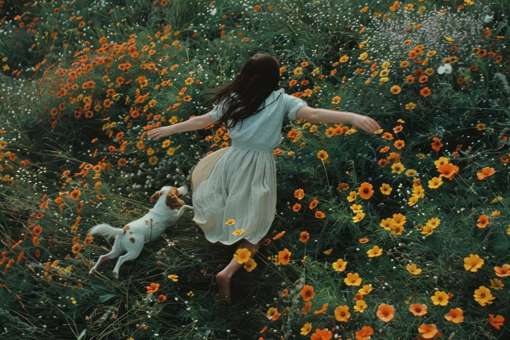A happy girl run floating with a dog flower field photography.