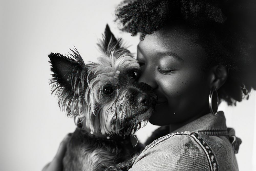 Black woman hugging yorkshire terrier dog portrait mammal animal.