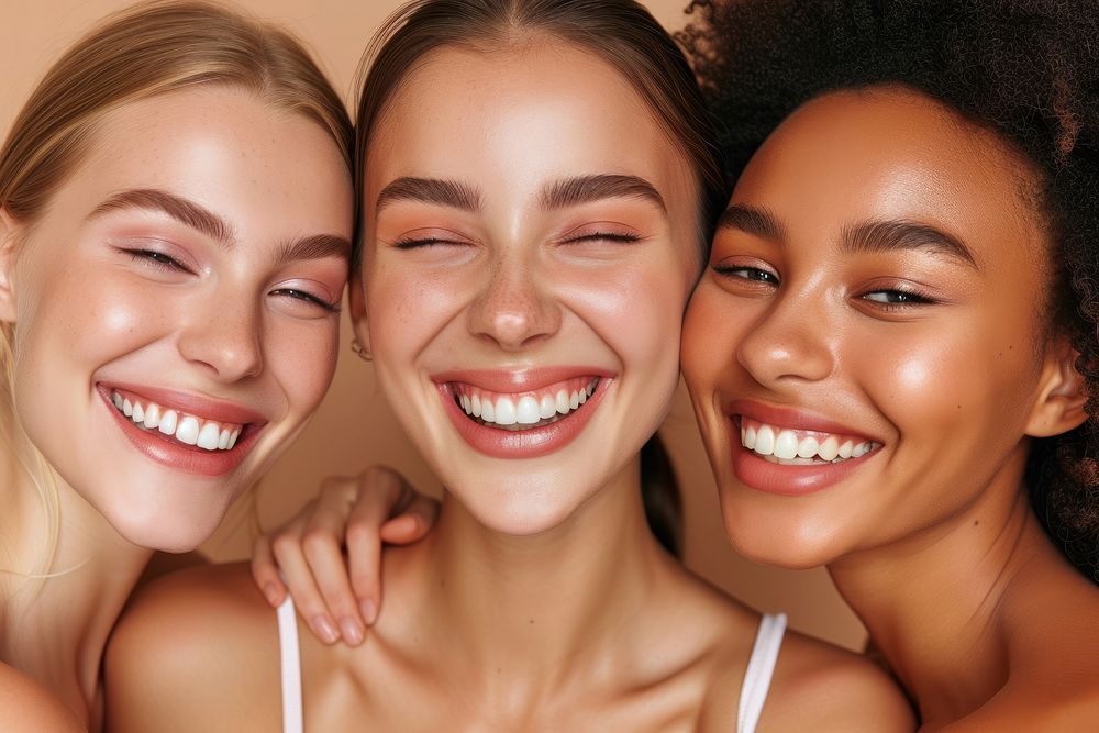 Diverse women face with no makeup laughing adult smile.
