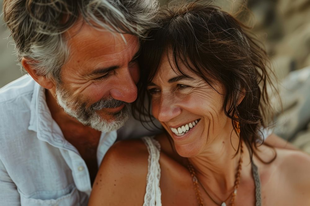 Middle-aged couple laughing portrait summer.