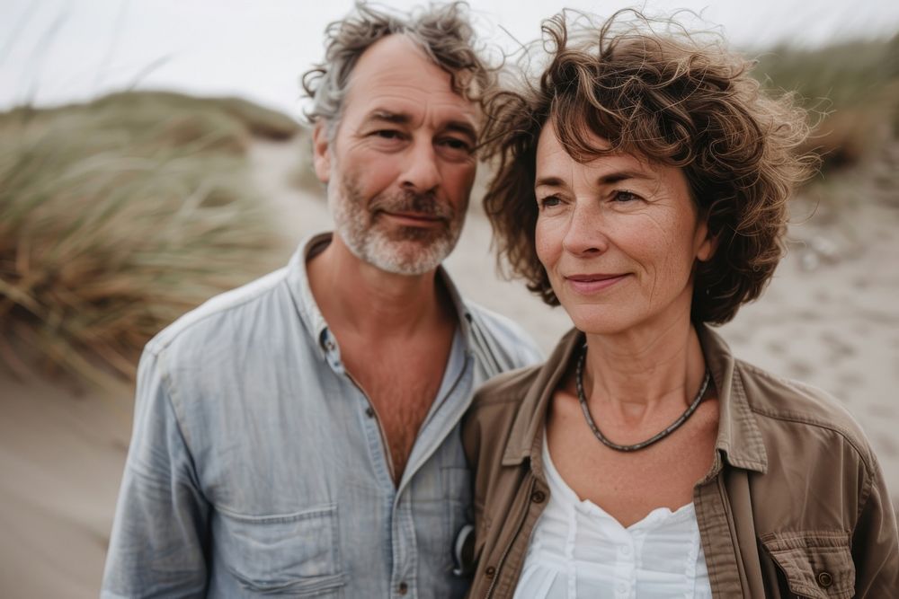 Middle-aged couple walking together portrait adult beach.