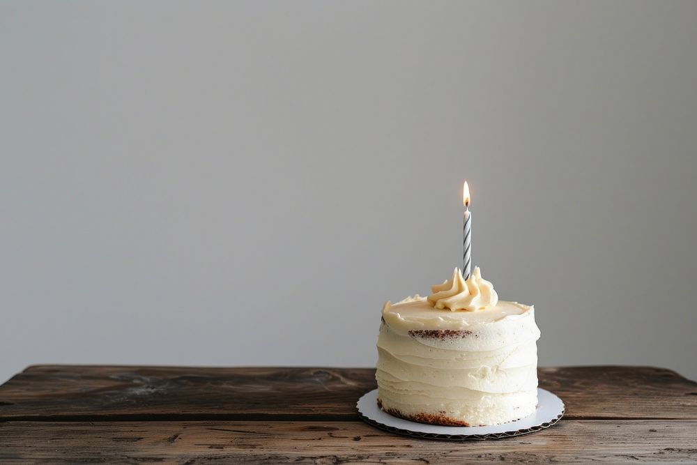 White birthday cake dessert candle icing.
