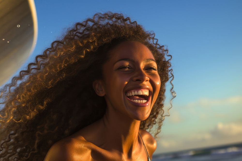 Happy African woman surfer laughing summer smile.