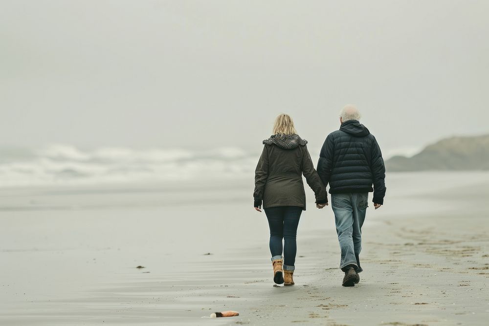 Older couple walking together beach adult togetherness.