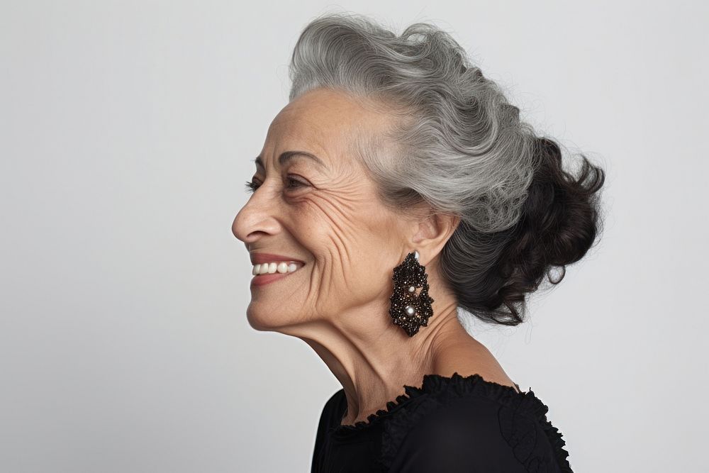 Older woman hispanic portrait laughing jewelry.