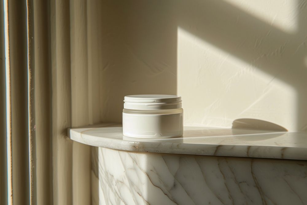 Skincare cream jar packaging architecture windowsill lighting.
