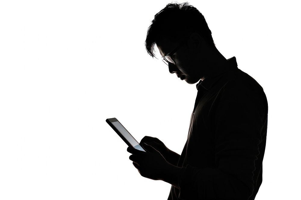 A man working on ipad silhouette adult white background.
