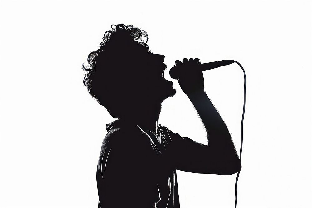 A man singing with a headphone on silhouette microphone adult.