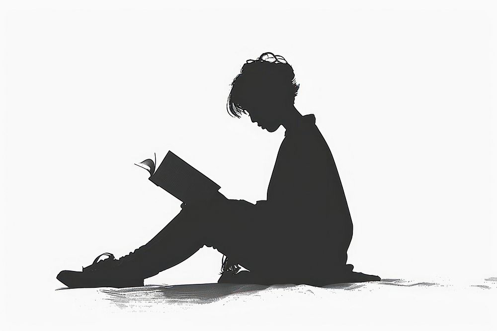 An open book silhouette sitting reading.