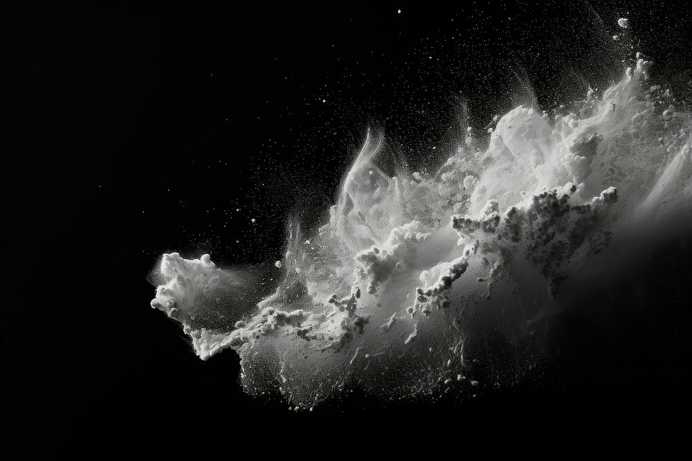 White dust stains on black night monochrome exploding.