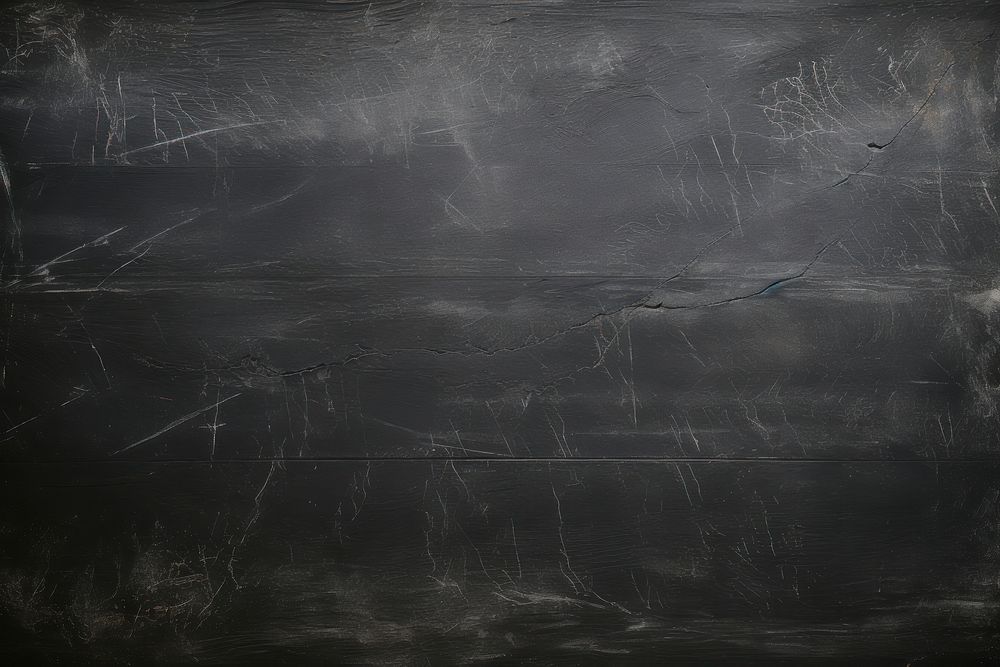 Chalk marks on a blackboard texture backgrounds monochrome.