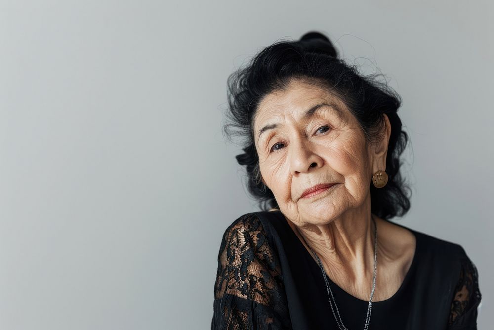 Hispanic old woman with black hime hair portrait photography adult.