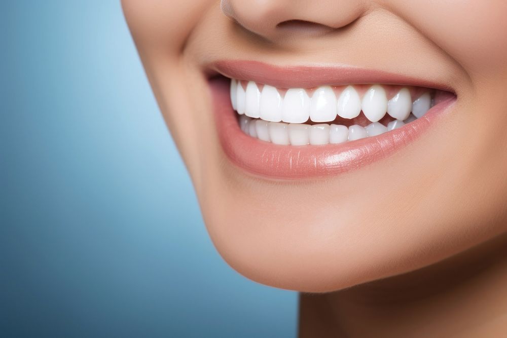 Women showing beautiful white smile teeth adult blue.