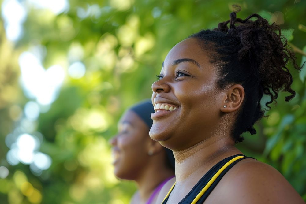 African American fit women deep breathing and smiling laughing smile adult.