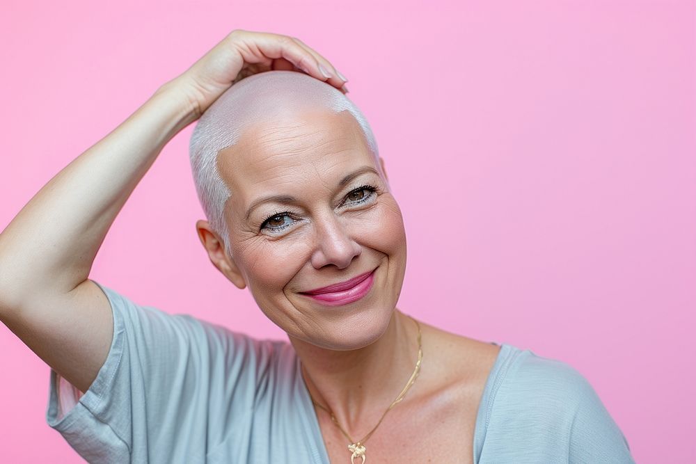 Bald middle age woman touching shaved head smile portrait adult.