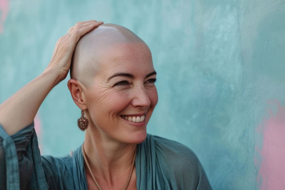 Bald middle age woman touching shaved head smile portrait adult.