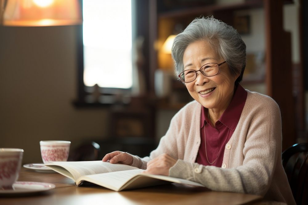 The elderly female mentor glasses reading wisdom.