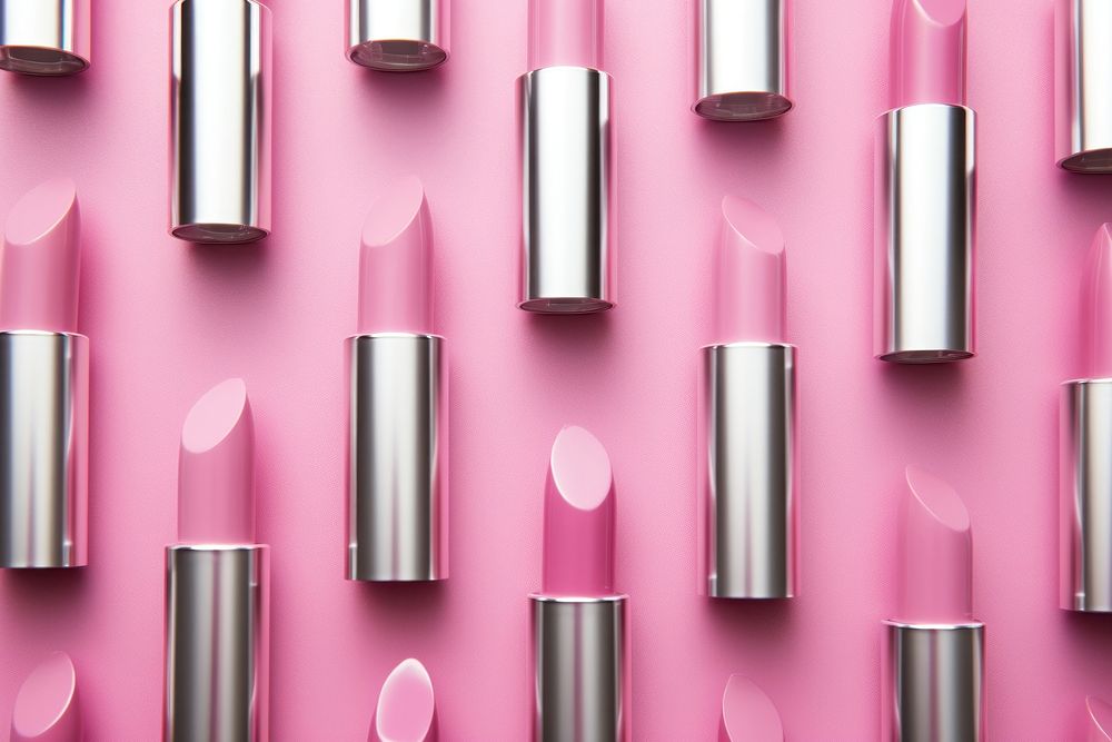 Pink lipstick pakege colour backgrounds cosmetics arrangement.