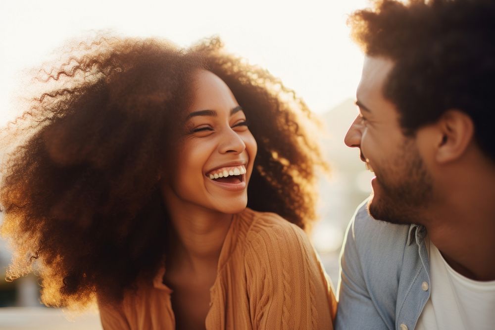 African american woman laughing with her couple smile adult togetherness.