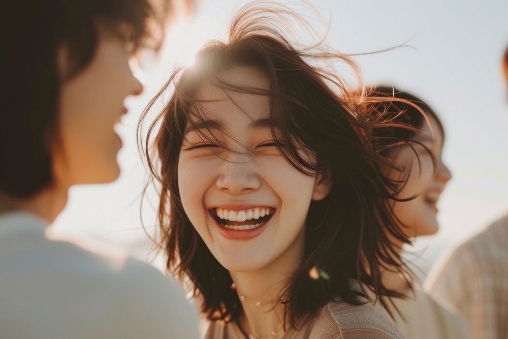 Korean girl laughing with her couple adult smile togetherness.