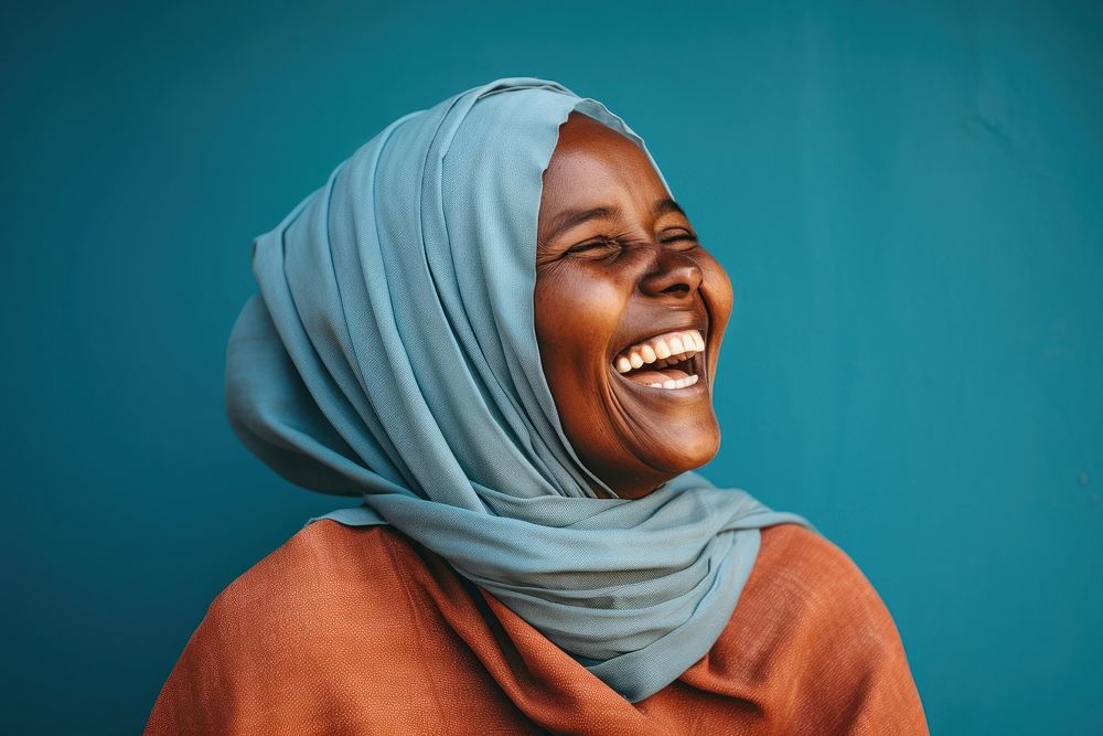 Somali woman laughing scarf smile happiness.