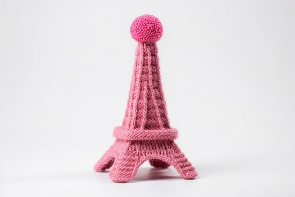 Eiffel tower knitted toy white background.
