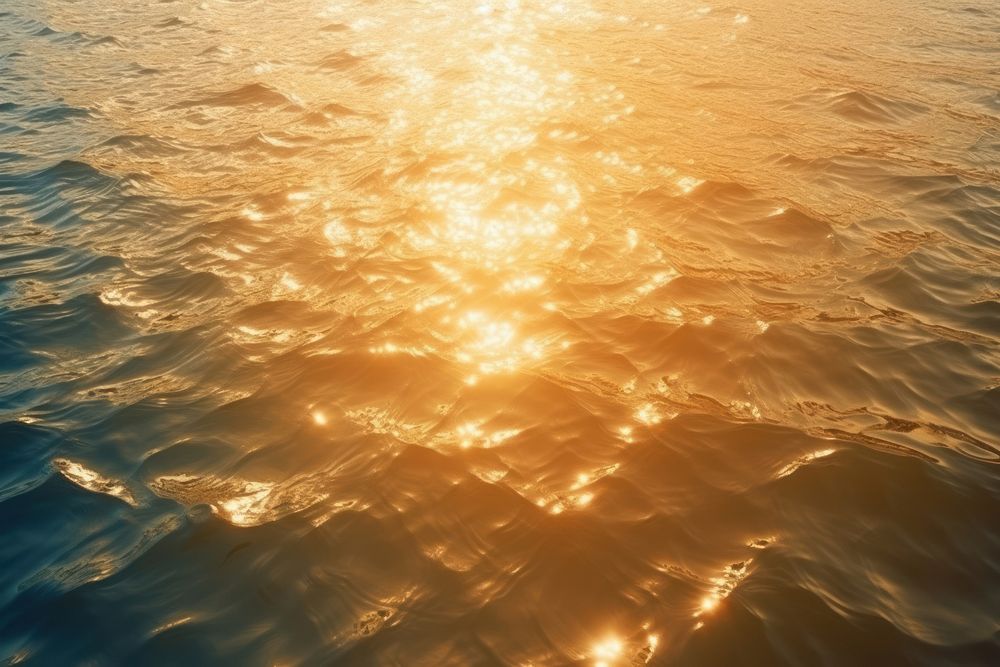 Gold sea backgrounds sunlight.