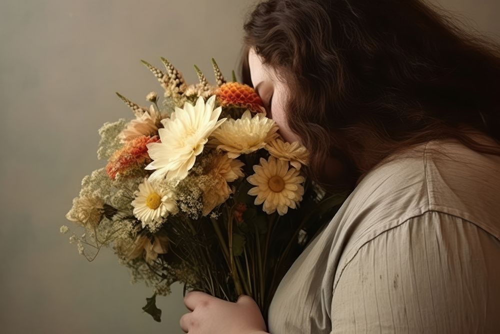Chubby body woman holding flowers adult plant contemplation.